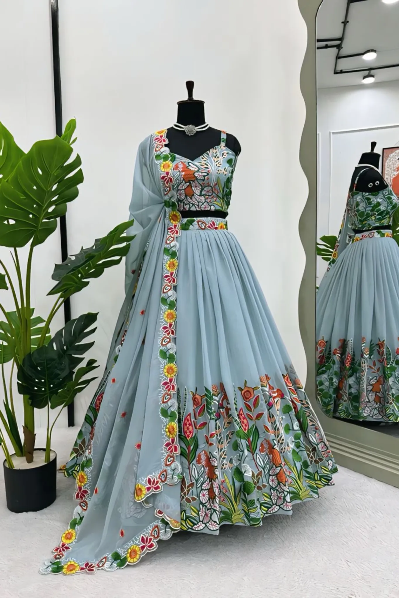 A FLOWERS LEHENGA CHOLI IS A TRADITIONAL INDIAN OUTFIT CHARACTERIZED ELEGANT DESING