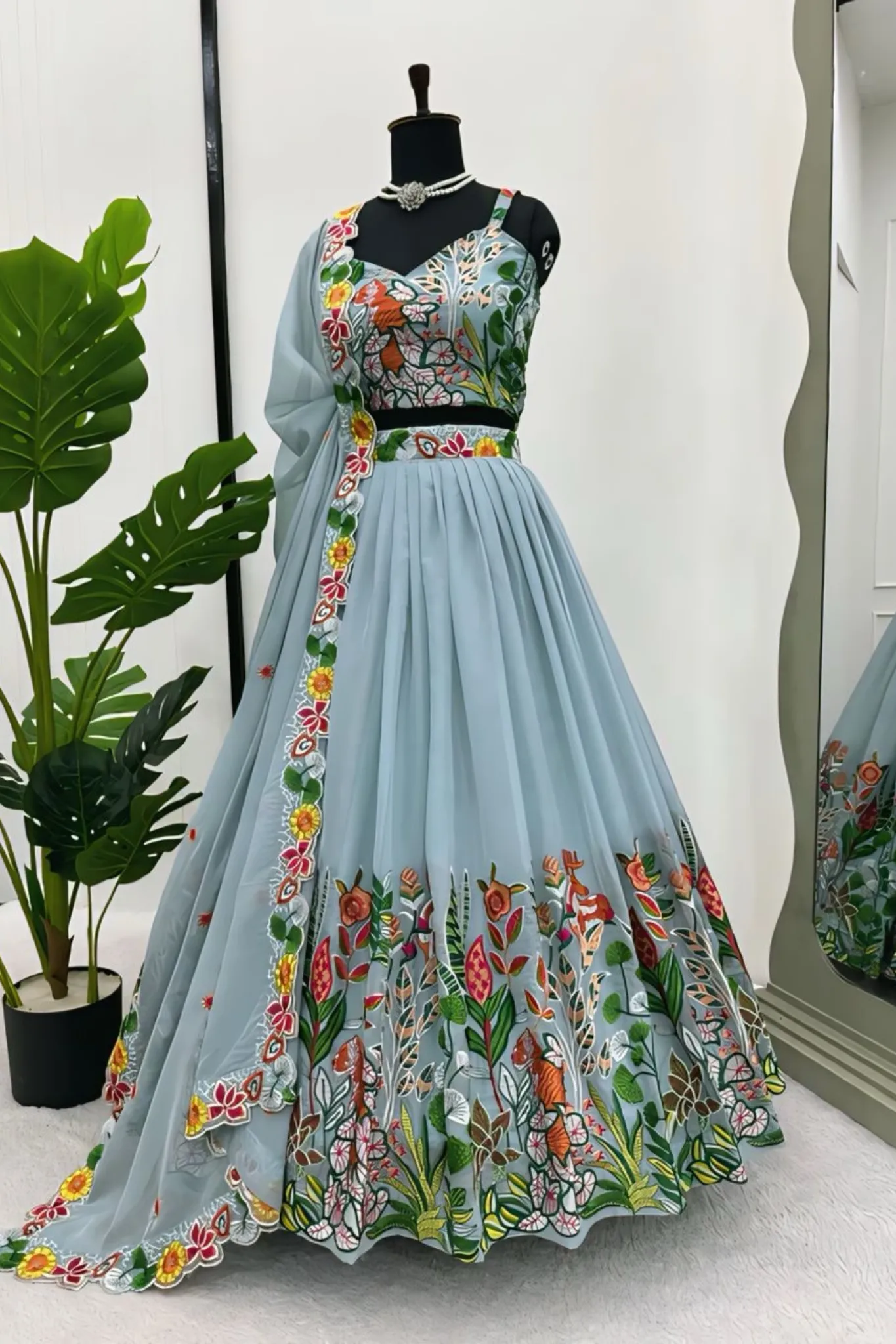 A FLOWERS LEHENGA CHOLI IS A TRADITIONAL INDIAN OUTFIT CHARACTERIZED ELEGANT DESING
