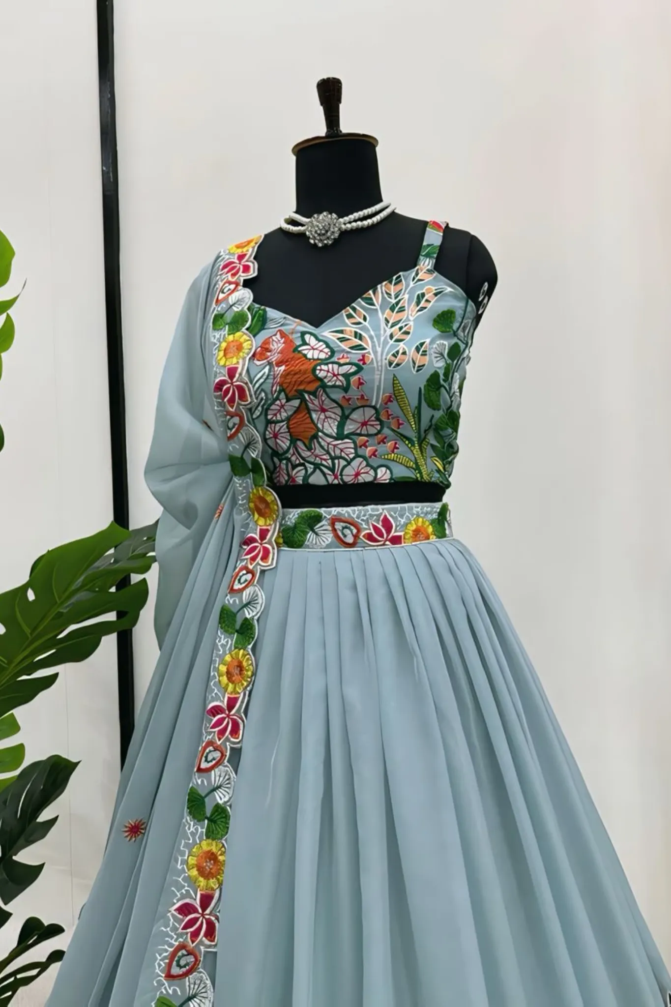 A FLOWERS LEHENGA CHOLI IS A TRADITIONAL INDIAN OUTFIT CHARACTERIZED ELEGANT DESING