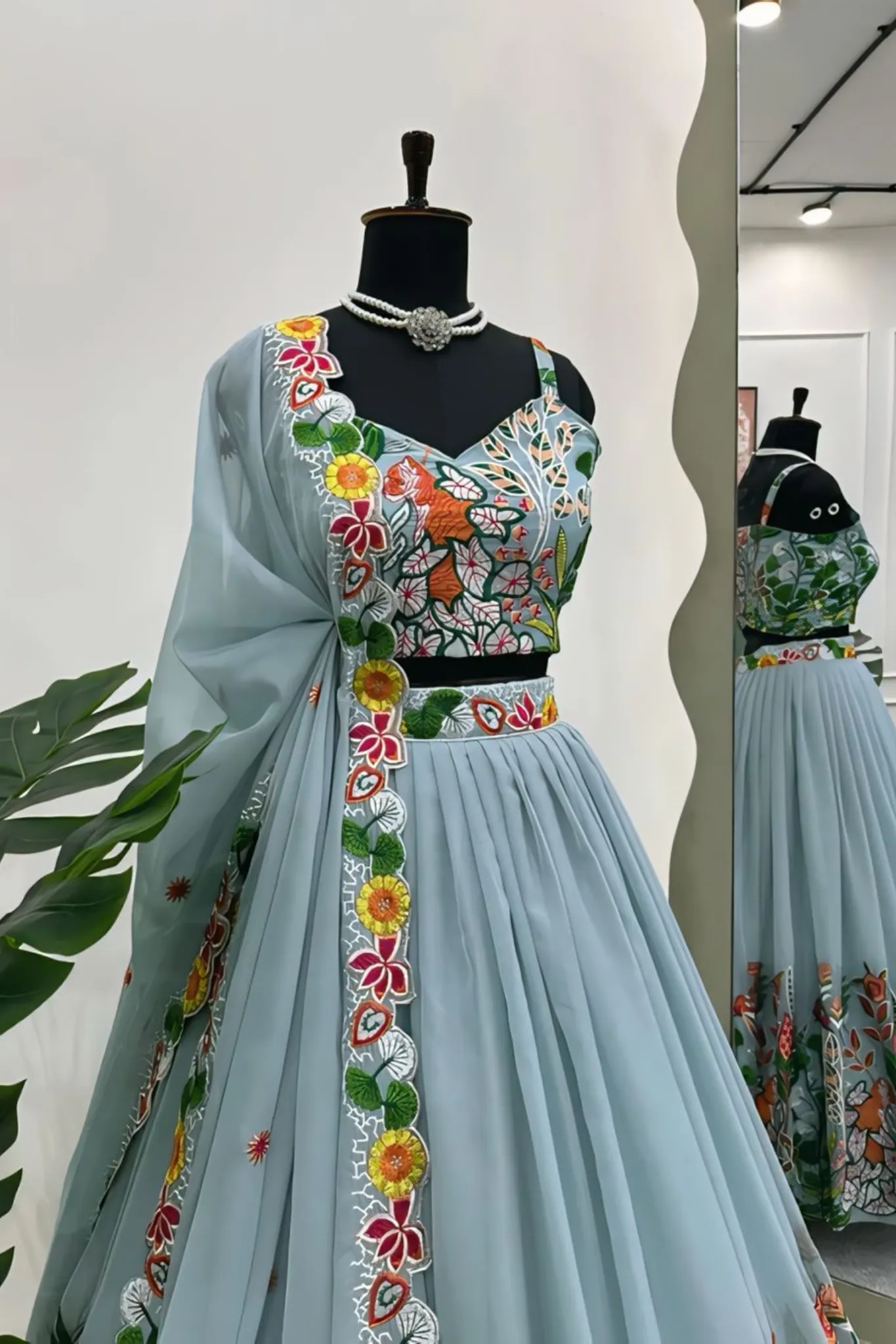 A FLOWERS LEHENGA CHOLI IS A TRADITIONAL INDIAN OUTFIT CHARACTERIZED ELEGANT DESING