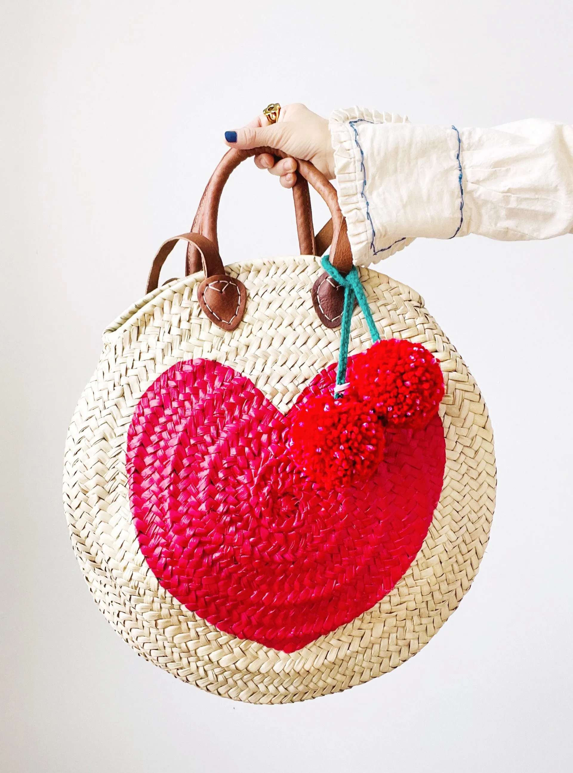 VIVA MAGENTA Round  Straw Bag with Leather Straps and Poms by Poppy Joy Pompoms
